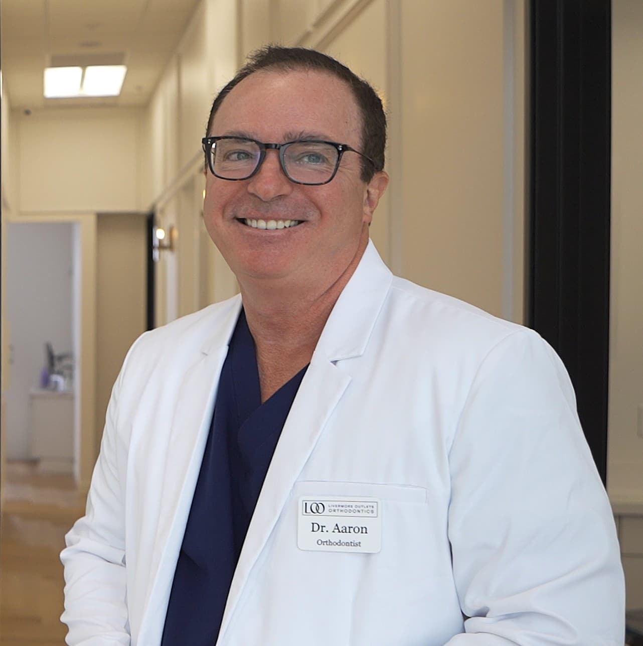 Dr. Rondon showing a patient her smile simulation on screen